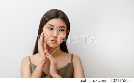 asian girl on grey background asian girl on grey background 102185894
