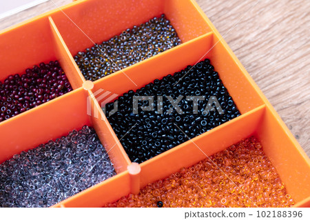 Colorful beads in containers close up, handicrafts Colorful beads in containers close up, handicrafts 102188396