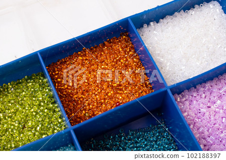 Colorful beads in containers close up, handicrafts Colorful beads in containers close up, handicrafts 102188397