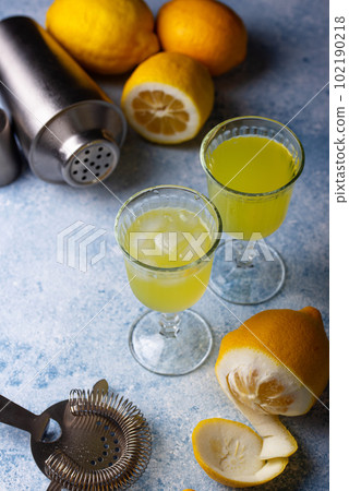 Traditional italian limoncello or lemon liquor 102190218