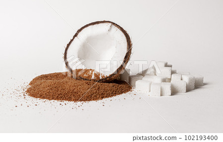 Coconut brown sugar pile, coco nut fruit, sweet ingredient vs white refined sweetener 102193400