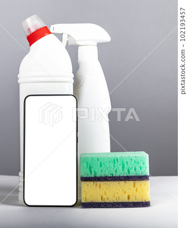 Smartphone screen mock-up for cleaning service app, phone display mockup with detergents, sponges Smartphone screen mock-up for cleaning service app, phone display mockup with detergents, sponges 102193457