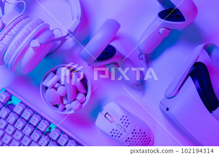 Keyboard with marshmallows and accessories on desk 102194314