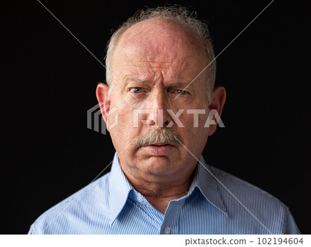 Angry and stressed grey haired senior man with mustache Angry and stressed grey haired senior man with mustache 102194604