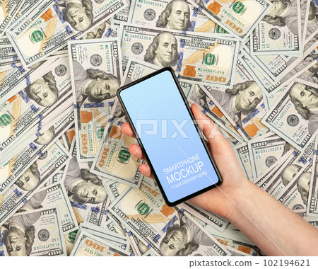 Mobile phone mockup, screen mock up on dollar banknotes, money for finance app 102194621