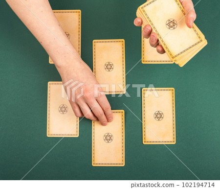 Lodz Poland April 15 2023 Tarot cards, pentagram spread, face down on green table 102194714