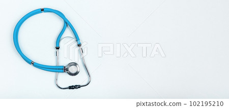 Blue stethoscope, hospital, healthcare tool. Medical banner background with copy space for text Blue stethoscope, hospital, healthcare tool. Medical banner background with copy space for text 102195210