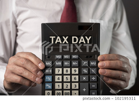 Tax day on calculator, USA taxation calculation deadline, 15 April 102195311