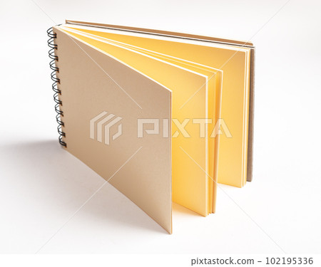 Artists stationery, open sketchbook with yellow paper pages for drawing Artists stationery, open sketchbook with yellow paper pages for drawing 102195336