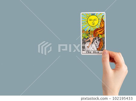 The sun, tarot card in hand. Banner background with copy space for text The sun, tarot card in hand. Banner background with copy space for text 102195433