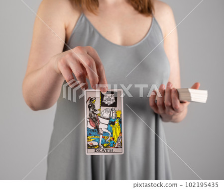 Death, tarot card in hand of taro reader, fortune teller Death, tarot card in hand of taro reader, fortune teller 102195435
