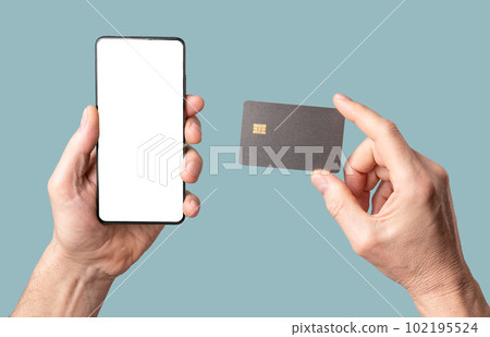 Mobile phone mock-up and bank credit card mockup in male hand isolated on white background 102195524