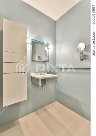 a bathroom with a sink and mirror on the wall above it is an image of someone's reflection in the mirror a bathroom with a sink and mirror on the wall above it is an image of someone's reflection in the mirror 102198694