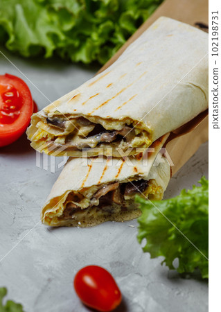 Shawarma sandwich gyro fresh roll of lavash chicken beef shawarma falafel RecipeTin Eatsfilled with grilled meat mushrooms cheese. Traditional Middle Eastern snack Shawarma sandwich gyro fresh roll of lavash chicken beef shawarma falafel RecipeTin Eatsfilled with grilled meat mushrooms cheese. Traditional Middle Eastern snack 102198731