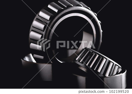 roller bearing on a black background close-up, blur as an artistic device roller bearing on a black background close-up, blur as an artistic device 102199520