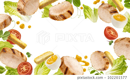 Falling chicken Caesar salad ingredients isolated on white background Falling chicken Caesar salad ingredients isolated on white background 102201577