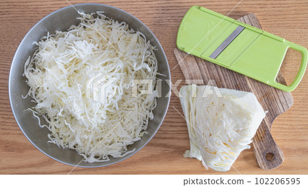 Cabbage shredded using a slicer image Cabbage shredded using a slicer image 102206595