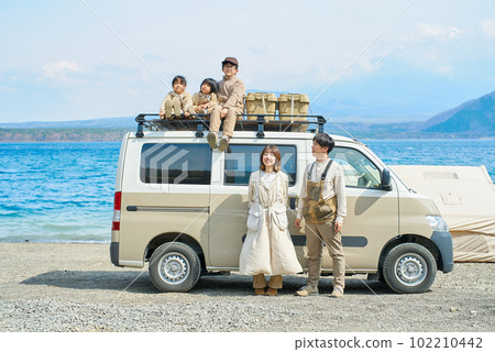 Family and camper enjoying the outdoors Family and camper enjoying the outdoors 102210442