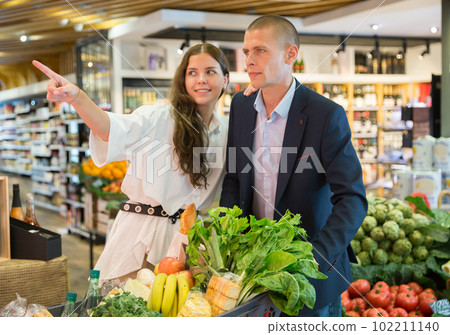 Portrait of a confident young couple in the supermarket 102211140