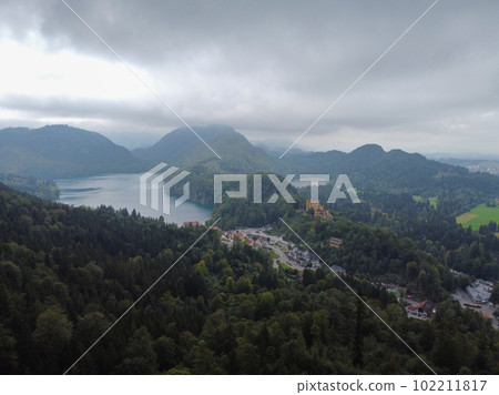 A vertical shot of an amazing view of mountains and a small lake among them 102211817