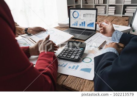 Business people adviser meeting to analyze and discussion on the financial report in the meeting room. Investment Consultant, Financial advisor and accounting concept Business people adviser meeting to analyze and discussion on the financial report in the meeting room. Investment Consultant, Financial advisor and accounting concept 102213579