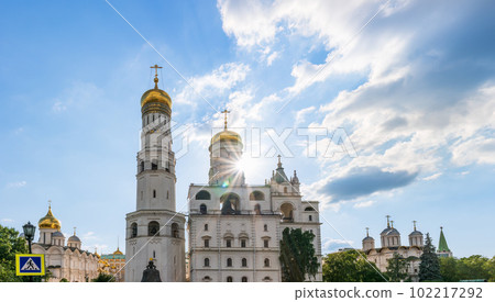 Ivan the Great Bell Tower, with Assumption Belfry on the right in Moscow Kremlin. Blue sky background with sunbeams 102217292