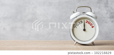 Happy New Year with vintage alarm clock and 2023 change to 2024 number. Merry Christmas, New Start, Resolution, countdown, Goals, Plan, Action and Mission Concept 102218829