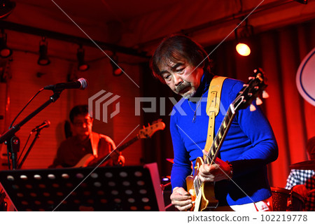 Vocals of a blues band performing at a live house Vocals of a blues band performing at a live house 102219778