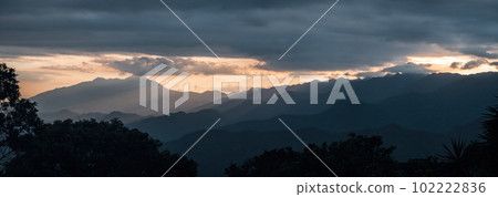 Majestic Mountain Range with Layers of Colors at Sunset Majestic Mountain Range with Layers of Colors at Sunset 102222836