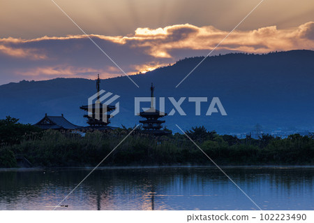 Kyo Yakushiji Temple in Nara West waiting for the sunrise The morning glow coloring the clouds in orange (3) 102223490