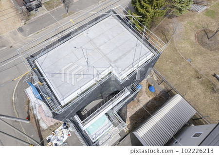 Aerial view of housing renovation Working on exterior wall painting 102226213