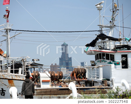 Southern Taiwan, Kaohsiung Port, Gushan Crossing, Kaohsiung townscape seen over fishing boats entering the port, 102227548