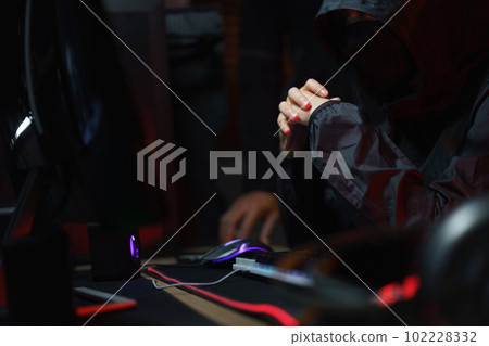 Hacker team looking code on screen concentrated while hacking programming system or data of server Hacker team looking code on screen concentrated while hacking programming system or data of server 102228332