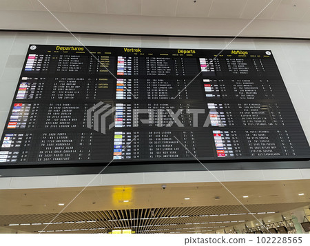 Brussels, Belgium - February 21, 2022: Electronic flights departures timetable board Brussels, Belgium - February 21, 2022: Electronic flights departures timetable board 102228565