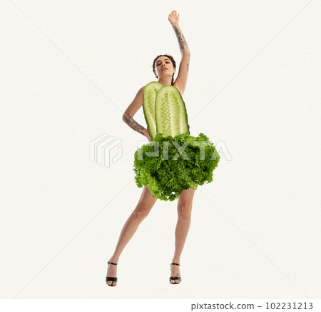 Slim, beautiful, young girl in cucumber and lettuce clothes over white background. Vegetarian. Contemporary art collage. 102231213