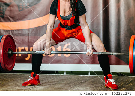 sportswoman powerlifter perform deadlift at powerlifting competition, power sports games 102231275
