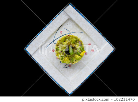 Vegetarian zucchini and avocado tartare with olive 102231470