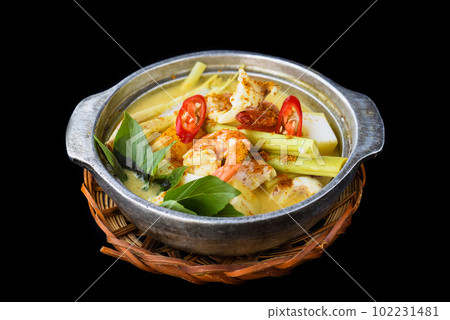 Vietnamese curry with shrimps and potato on black background for a menu Vietnamese curry with shrimps and potato on black background for a menu 102231481