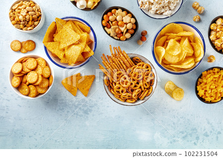 Salty snacks, party mix, overhead flat lay shot with copy space. An assortment 102231504