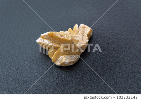 Desert Rose. Natural mineral close up of stone cluster from sand gypsum crystal, black background Desert Rose. Natural mineral close up of stone cluster from sand gypsum crystal, black background 102232142