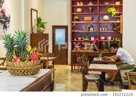 Loft style with wooden furniture in a Vietnamese coffee shop Loft style with wooden furniture in a Vietnamese coffee shop 102232220