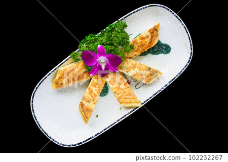 French egg omelette on plate cut on pieces isolated for a menu French egg omelette on plate cut on pieces isolated for a menu 102232267