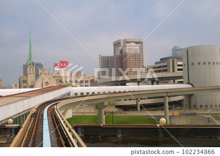 DETROIT, MICHIGAN, UNITED STATES - MAY 22nd, 2018: Riding the 'Detroit People Mover' Tramway in Detroit Downtown. The elevated monorail is one of many public modes of transportation in the city DETROIT, MICHIGAN, UNITED STATES - MAY 22nd, 2018: Riding the 'Detroit People Mover' Tramway in Detroit Downtown. The elevated monorail is one of many public modes of transportation in the city 102234866