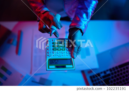 Upper view of modern business woman with calculator 102235191