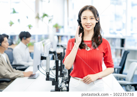 Young female operator wearing a headset Young female operator wearing a headset 102235738