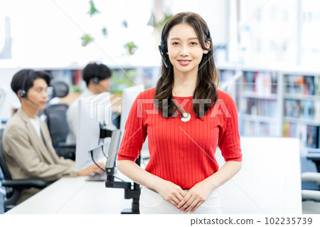Young female operator wearing a headset Young female operator wearing a headset 102235739