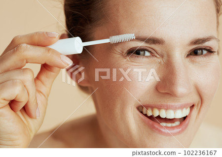 smiling woman with brow brush 102236167