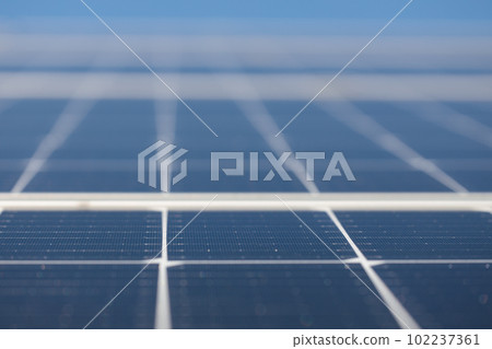 Close-up on solar panels and flower - alternative energy production. Close-up on solar panels and flower - alternative energy production. 102237361