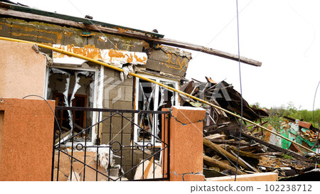 A residential building destroyed during the Russian-Ukrainian war in a Ukrainian village. Panorama 102238712