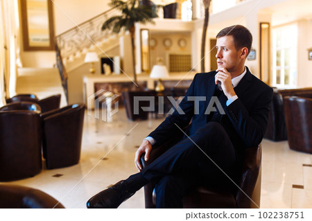 Luxury groom in suit. Businessman. The morning of the groom, bridegroom's fees. Sexy man in suit posing. 102238751